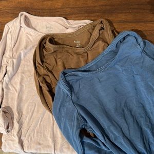 Three Kyte long sleeve bodysuits